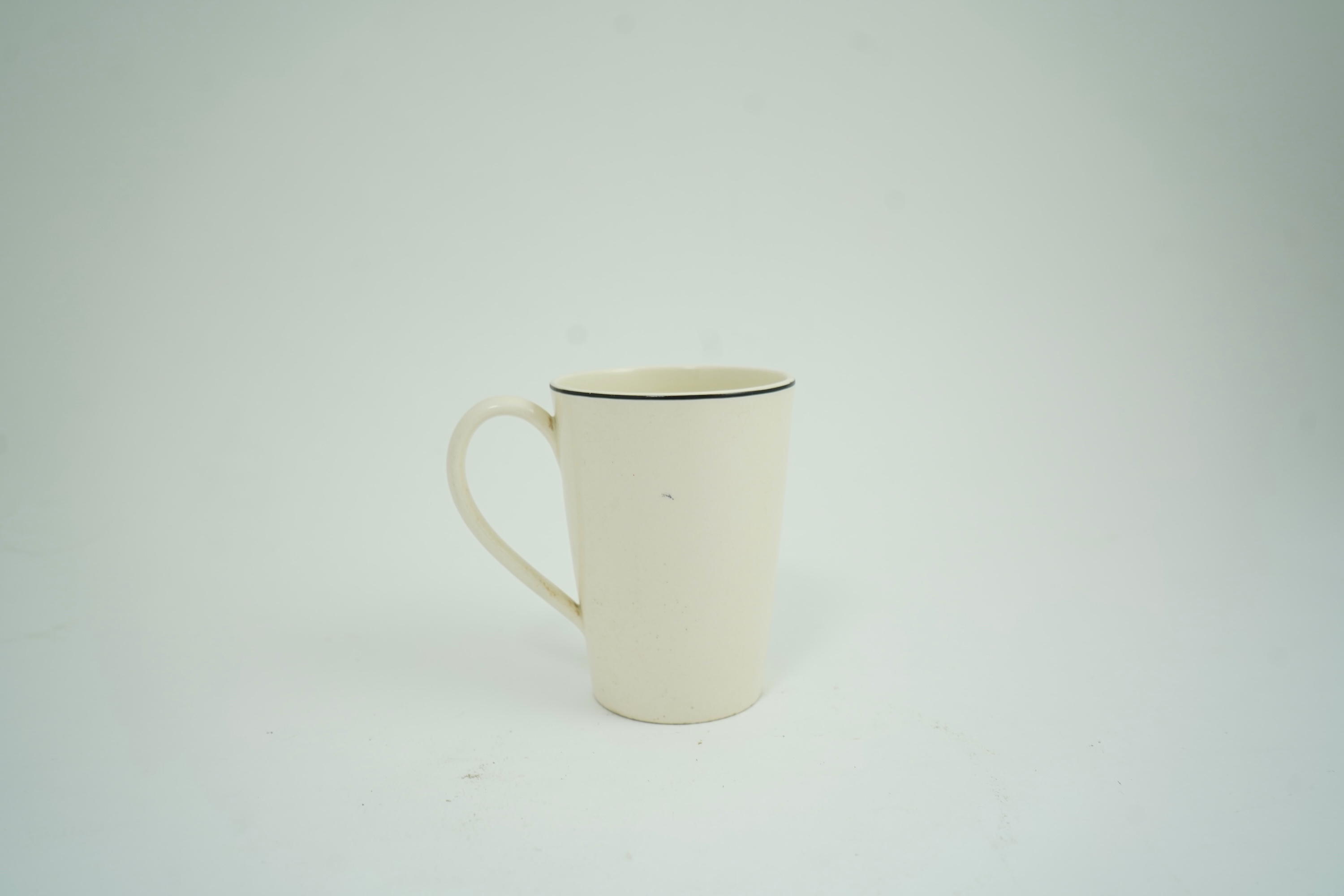 Eric Ravilious (1903-1942) for Wedgwood: A 'Garden Implements' lemonade mug